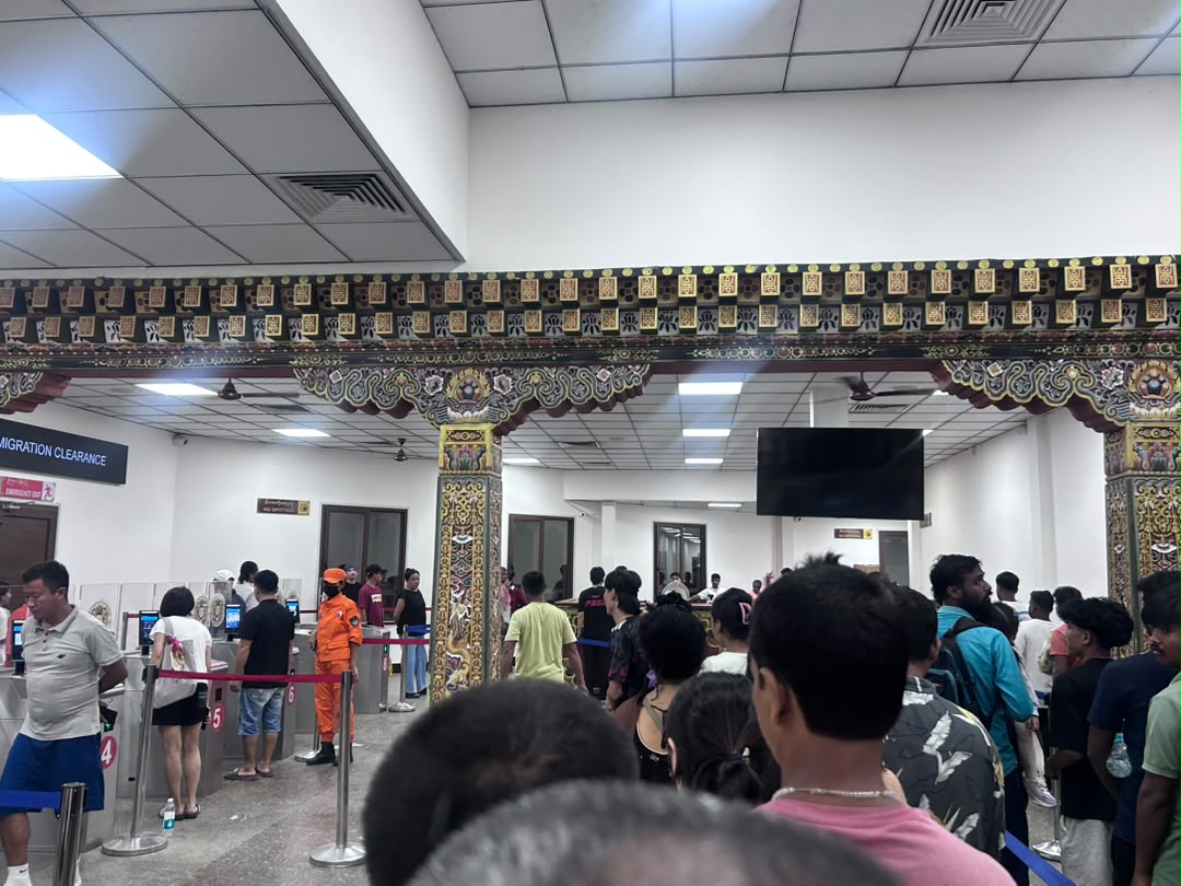 Travellers queuing at immigration counters